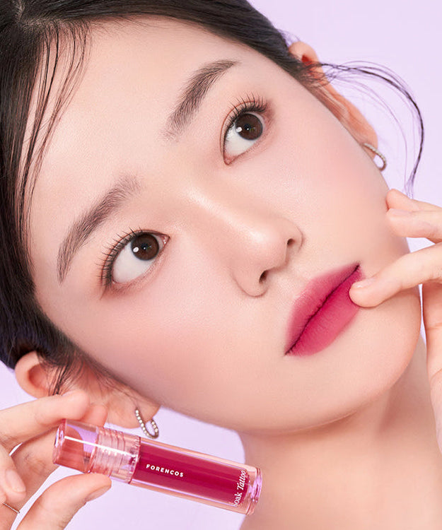 Model showcasing FORENCOS Renewal Tattoo Tint in pink shade with flawless makeup look.