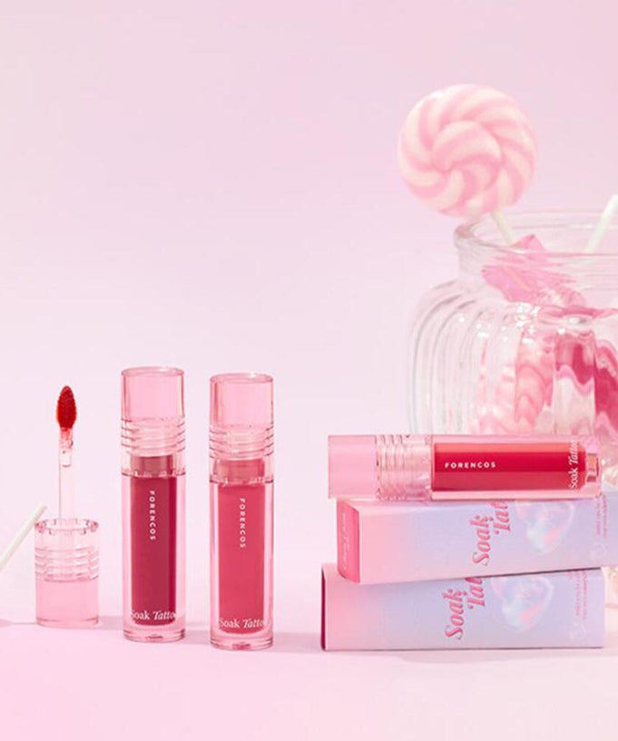 FORENCOS Renewal Tattoo Tint in vibrant pink shades with packaging and lollipop display.