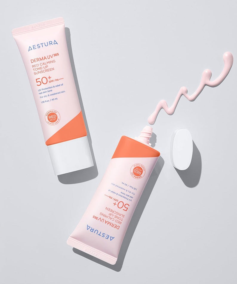 AESTURA Derma UV365 Red Calming Tone-Up Sunscreen 40ml tubes with cream on a light surface.