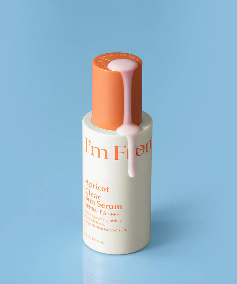I'M FROM Apricot Clear Sun Serum 50ml bottle on blue background with product flow.