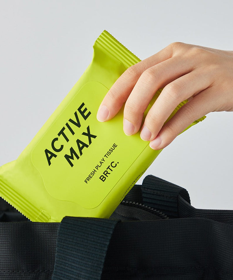 Gentleman Korea product image showing a hand placing BRTC Homme Active Max Fresh Play Tissue 15 Sheets into a bag