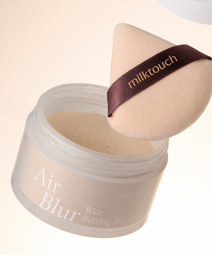 MILK TOUCH Air Blur Rice Setting Powder with applicator for smooth, flawless finish.
