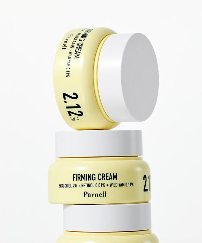 Close-up of PARNELL Firming Cream jars stacked, highlighting ingredients and packaging design.