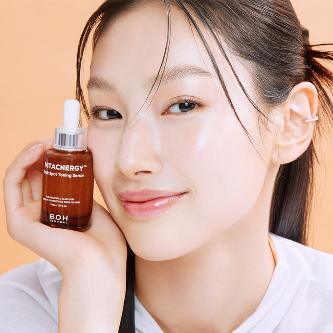 Woman holding BIO HEAL BOH Vitacnergy Dark Spot Toning Serum for radiant skin