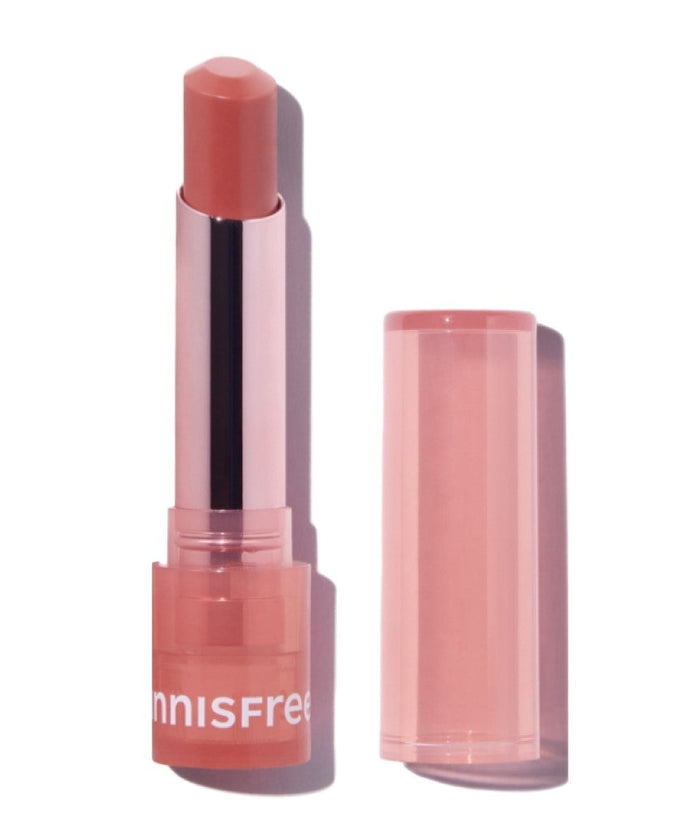 INNISFREE Dewy Tint Lip Balm 3.2g in pink packaging with open cap, showcasing the lip balm's sleek design and dewy finish.