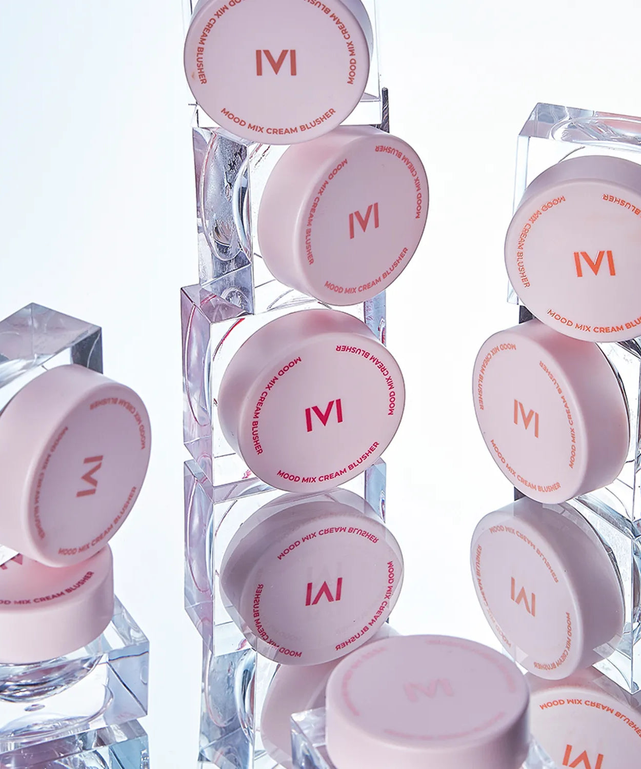 IVI MAD PEACH Mood Mix Cream Blusher collection displayed against a reflective surface for a modern aesthetic.