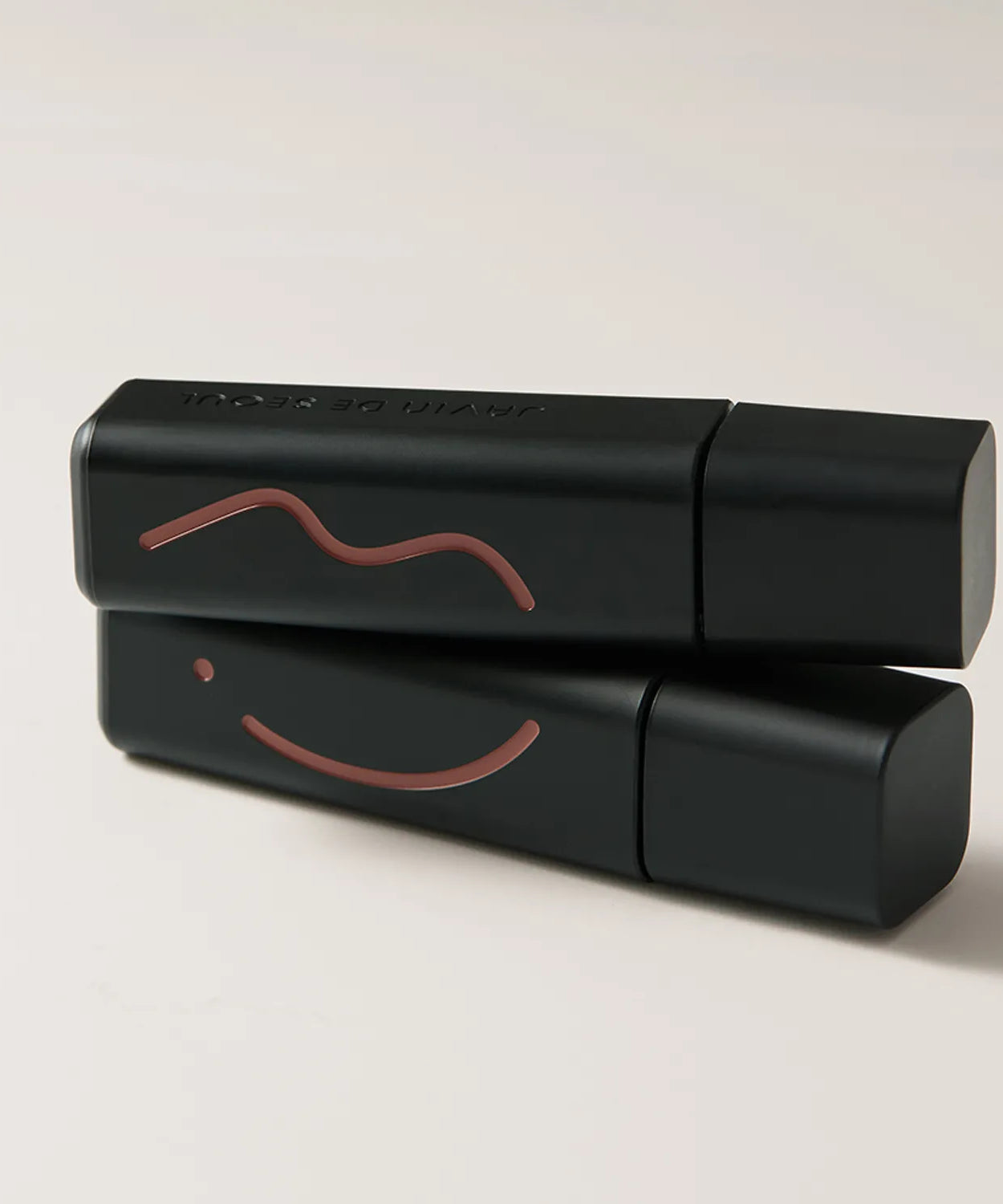 JAVIN DE SEOUL Wink Lip Shade Primer with elegant black packaging and artistic line design