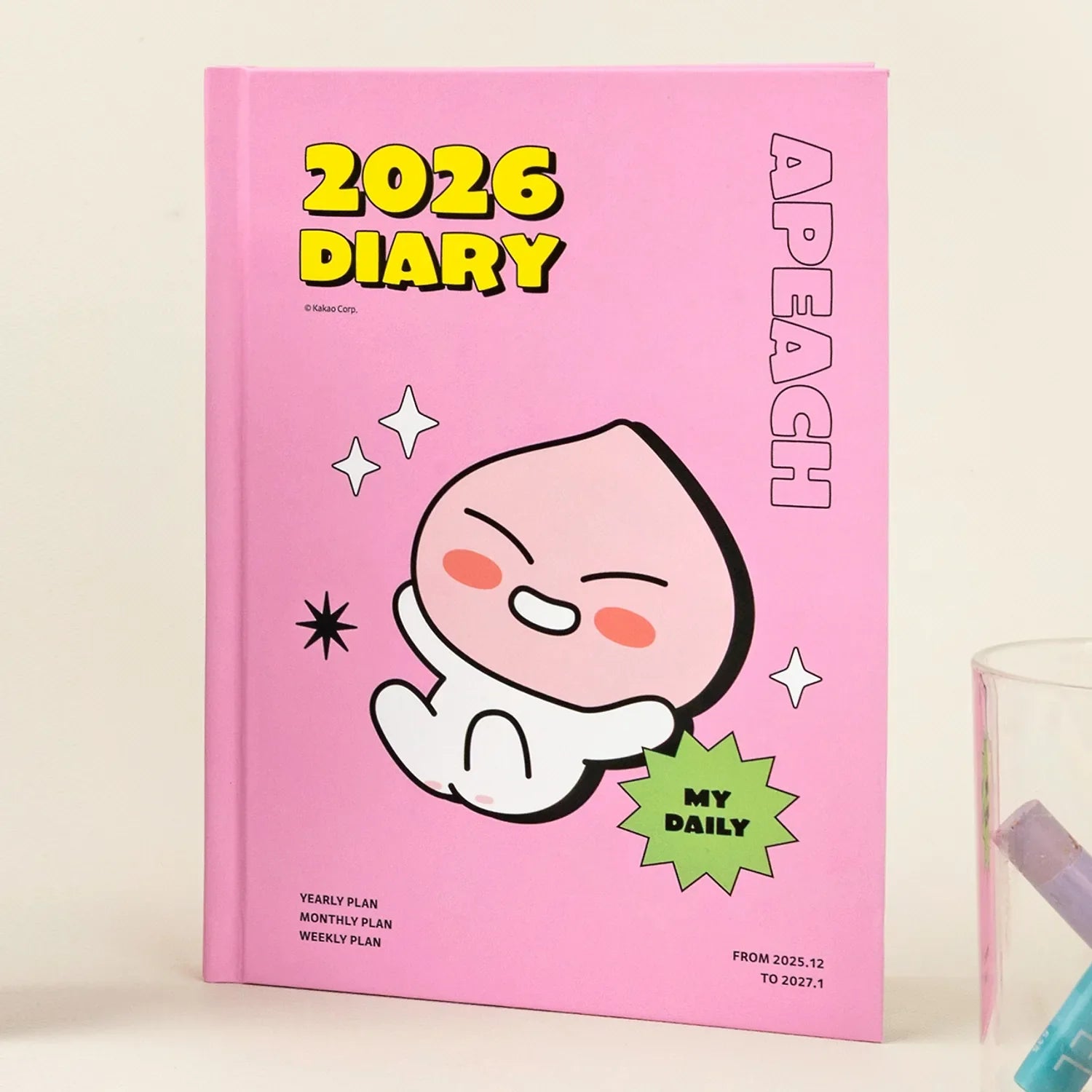 KAKAO FRIENDS Planner 2026 featuring APEACH on a pink cover for organizing yearly, monthly, and weekly plans.