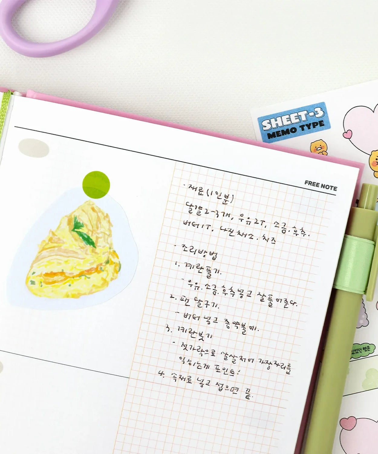 Open KAKAO FRIENDS Planner 2026 showing notes, drawing, and colorful stickers. Perfect for organizing and planning in style.