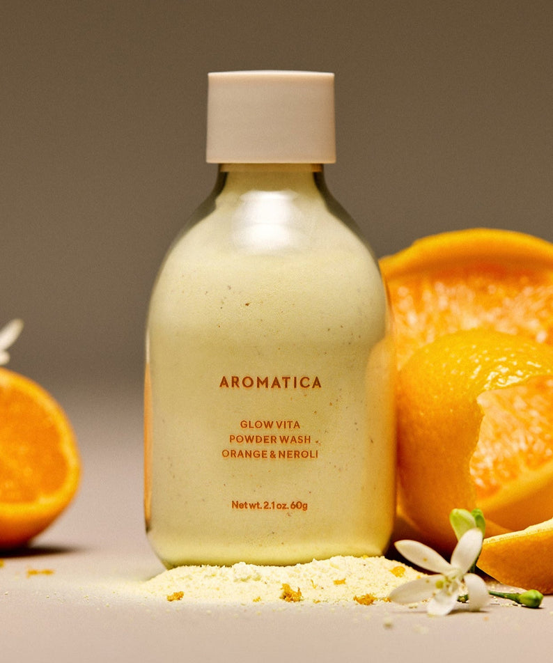 AROMATICA Glow Vita Powder Wash Orange & Neroli 60G with fresh orange halves and blossoms