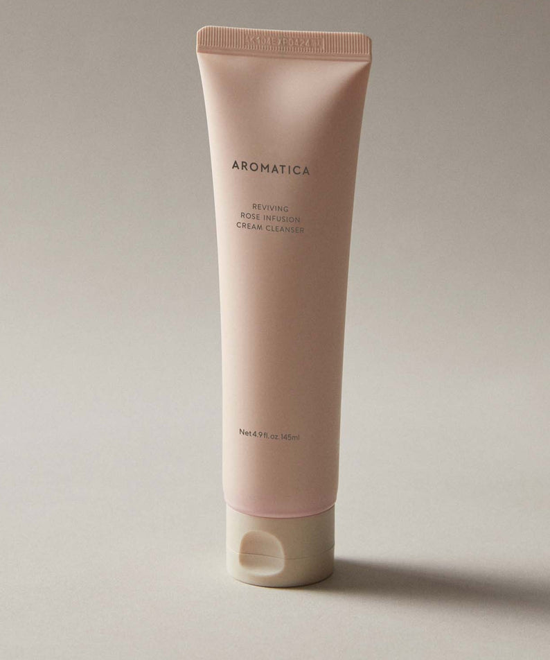 AROMATICA Reviving Rose Infusion Cream Cleanser 145ML in beige tube on neutral background