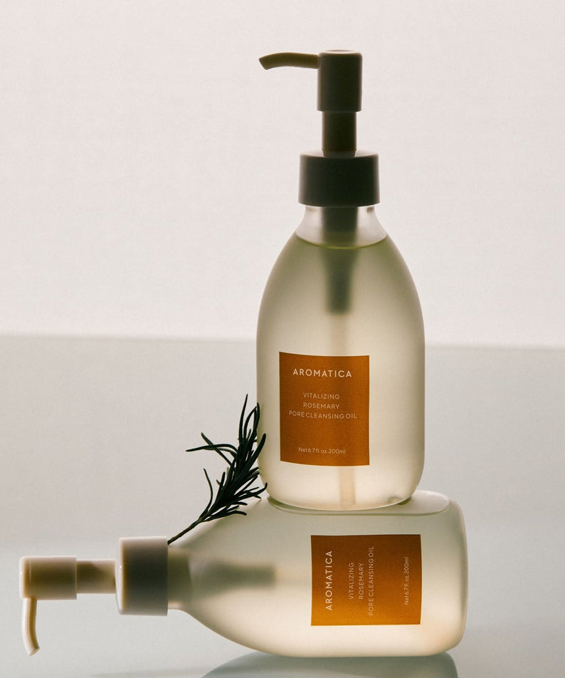 AROMATICA Vitalizing Rosemary Pore Cleansing Oil 200ML bottles on a reflective surface with rosemary sprig.