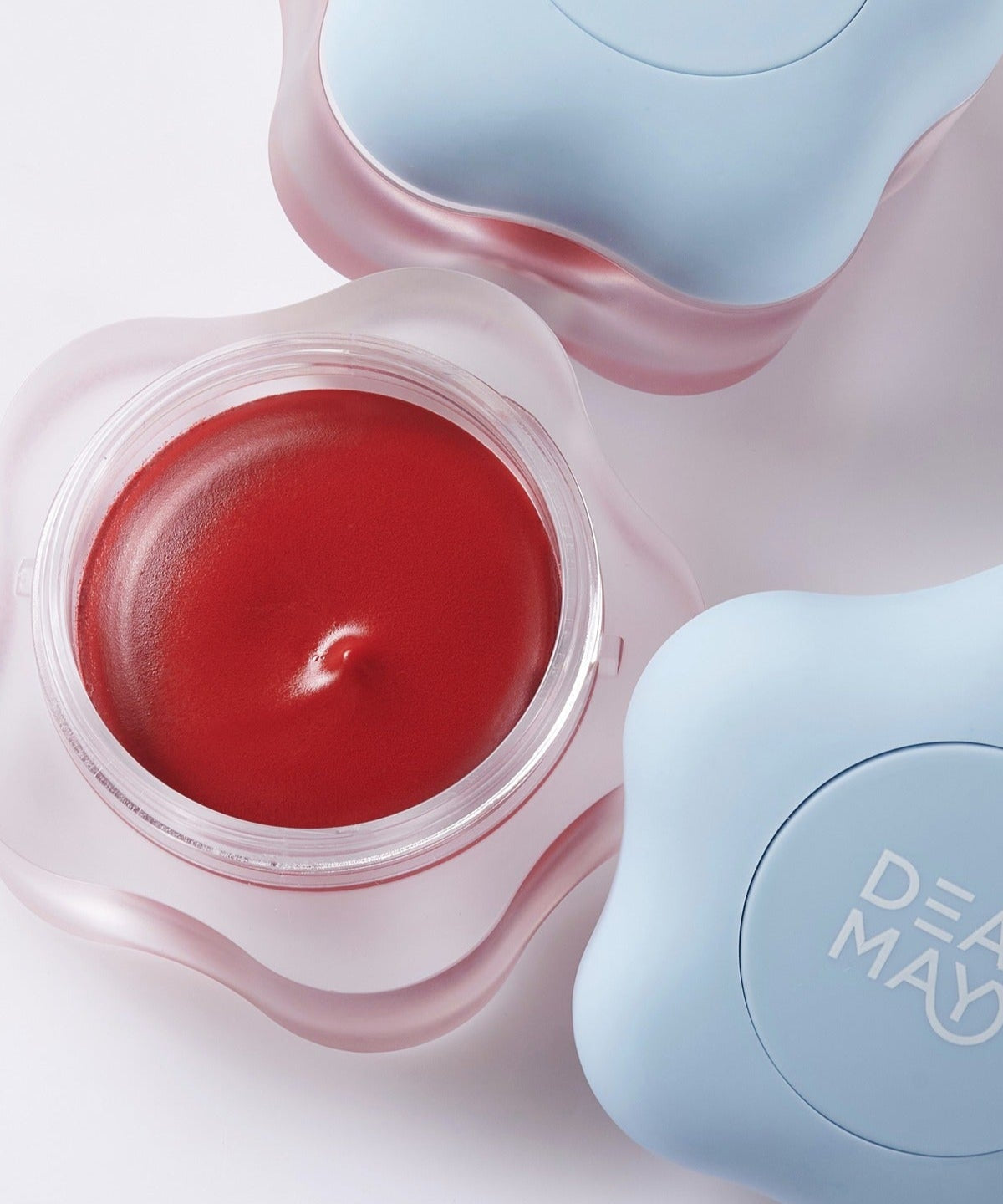DEAR MAY Pure Falling Mood Lip Pot 6.5g in open and closed pots with vibrant red lip color.