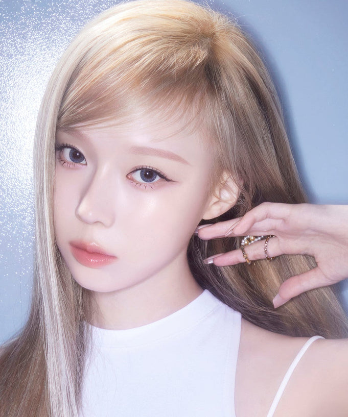 Model wearing ESPOIR BE GLOW FOUNDATION SPF27 PA++ highlighting radiant skin.