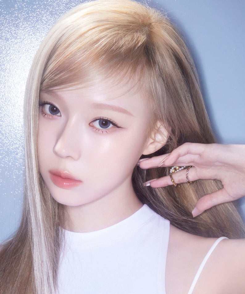 Model wearing ESPOIR BE GLOW FOUNDATION SPF27 PA++ highlighting radiant skin.