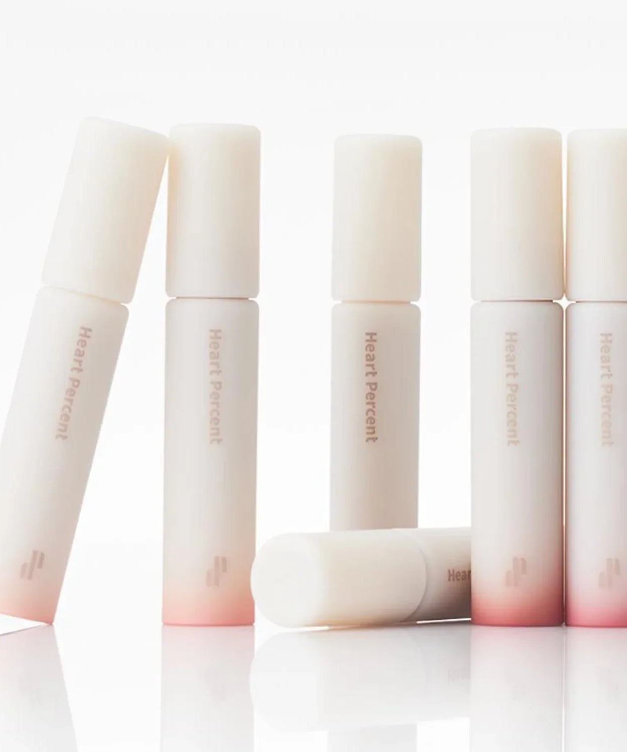 HEART PERCENT Dot On Mood All Cover Lip Base in elegant packaging with gradient design, perfect for a flawless lip finish.