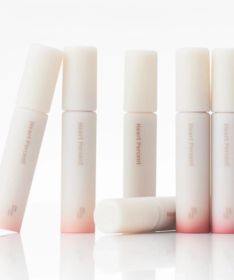 HEART PERCENT Dot On Mood All Cover Lip Base in elegant packaging with gradient design, perfect for a flawless lip finish.