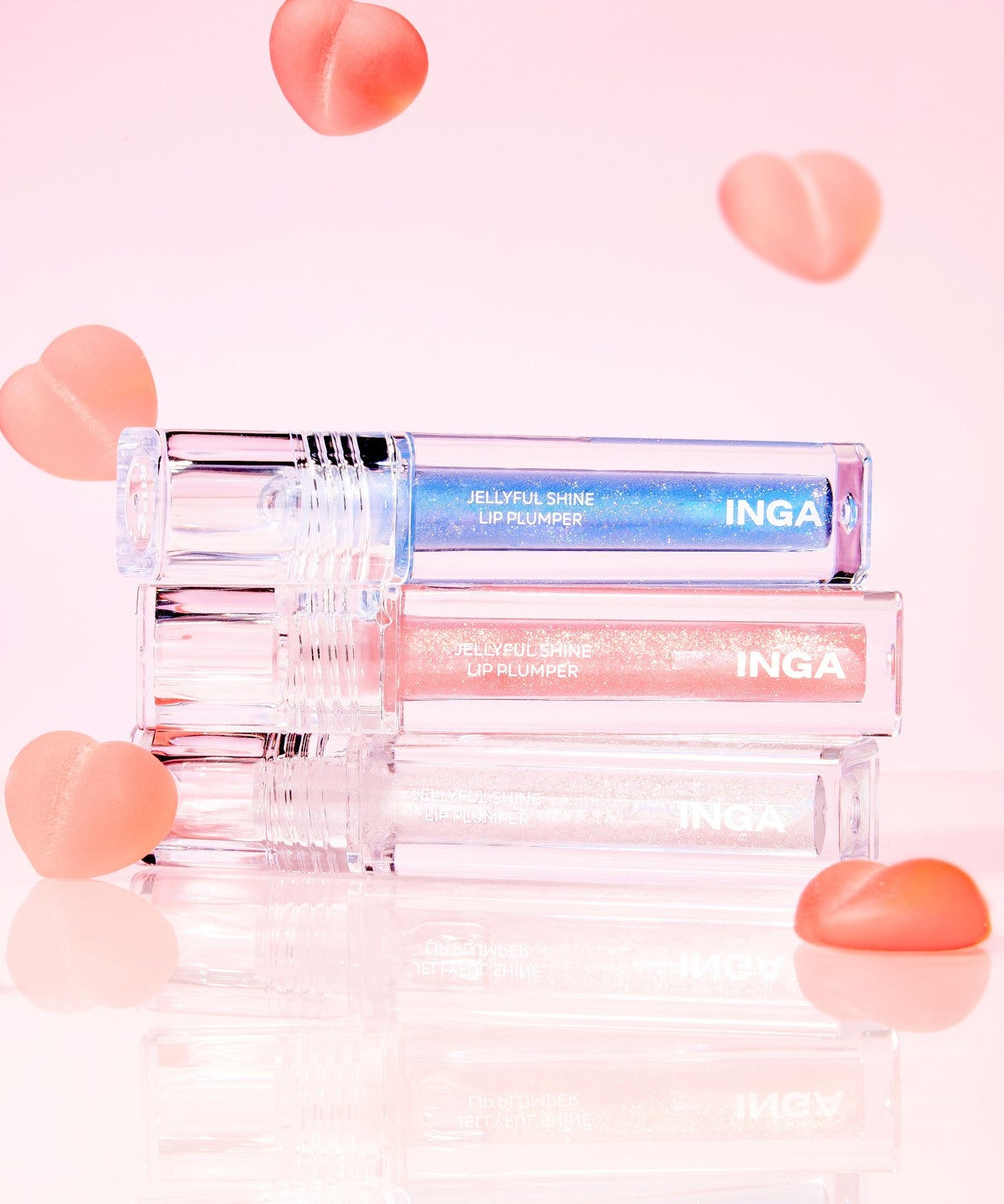 INGA Jellyful Shine Lip Plumper products with pink and blue shades on a pink background.