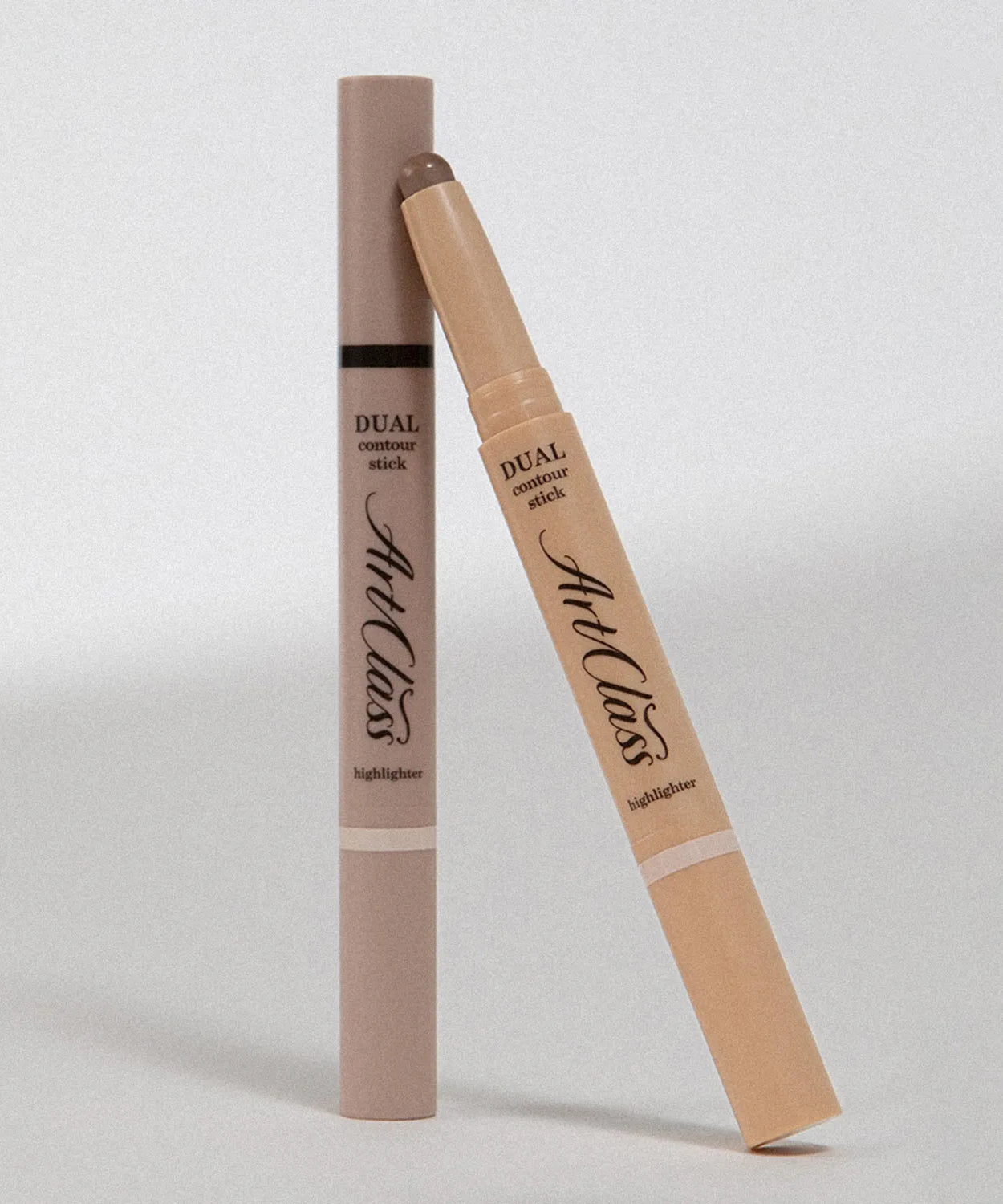 TOO COOL FOR SCHOOL By Rodin Dual Contour Stick in packaging, highlighting the contouring and highlighting dual functionality.