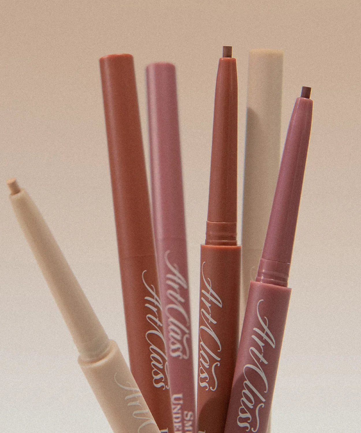 TOO COOL FOR SCHOOL Artclass Smudging Under Liner in various colors, showcasing sleek design and versatile makeup use.