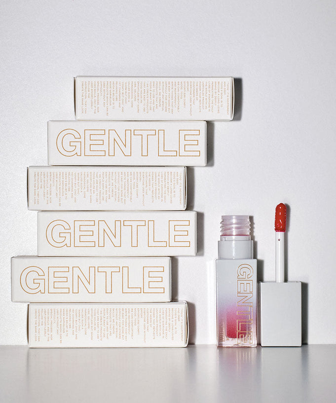 TOOQ Gentle Kiss Glow Tint packaging and open tube with applicator.