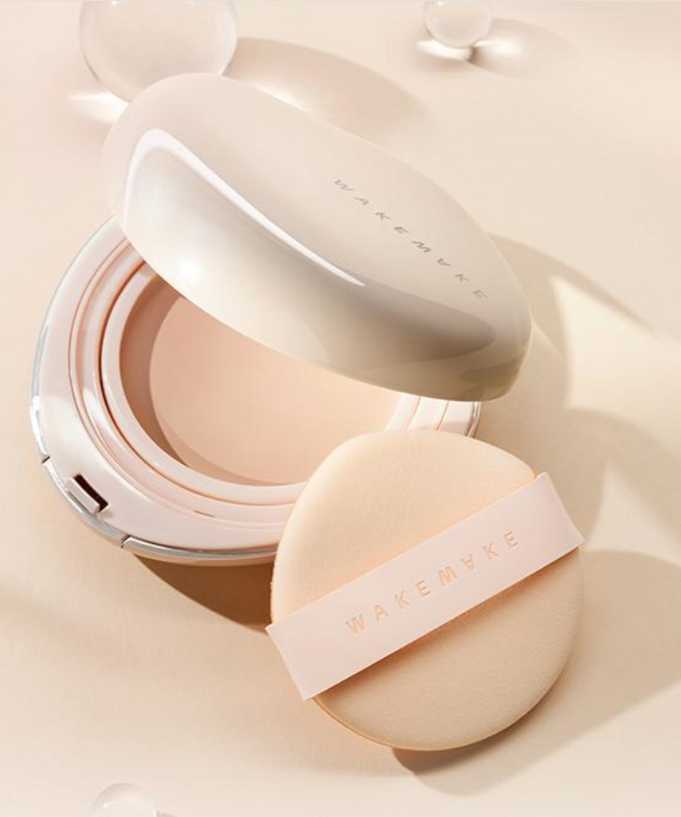 WAKE MAKE Water Glow Coating Balm 12.5g with applicator on beige background, showcasing makeup product design and packaging