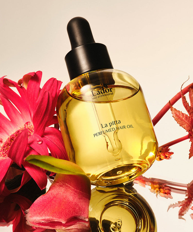 LADOR Perfume Hair Oil 30ml bottle with floral background