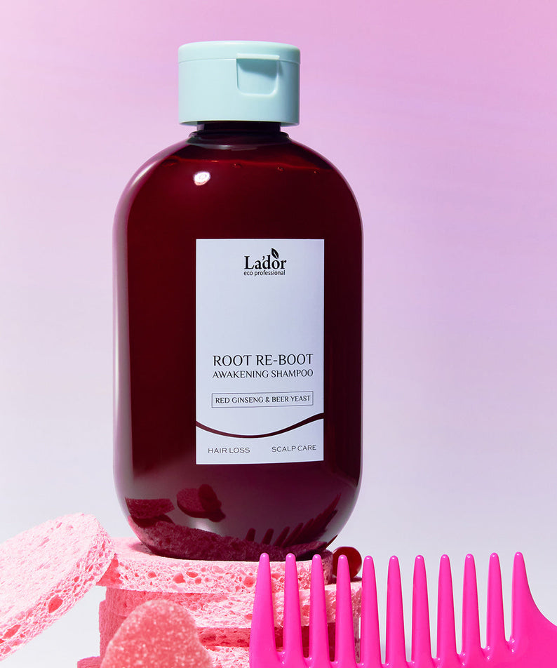 LADOR Root Reboot Custom Hair Loss Shampoo 4 Types bottle with pink comb and sponge background.