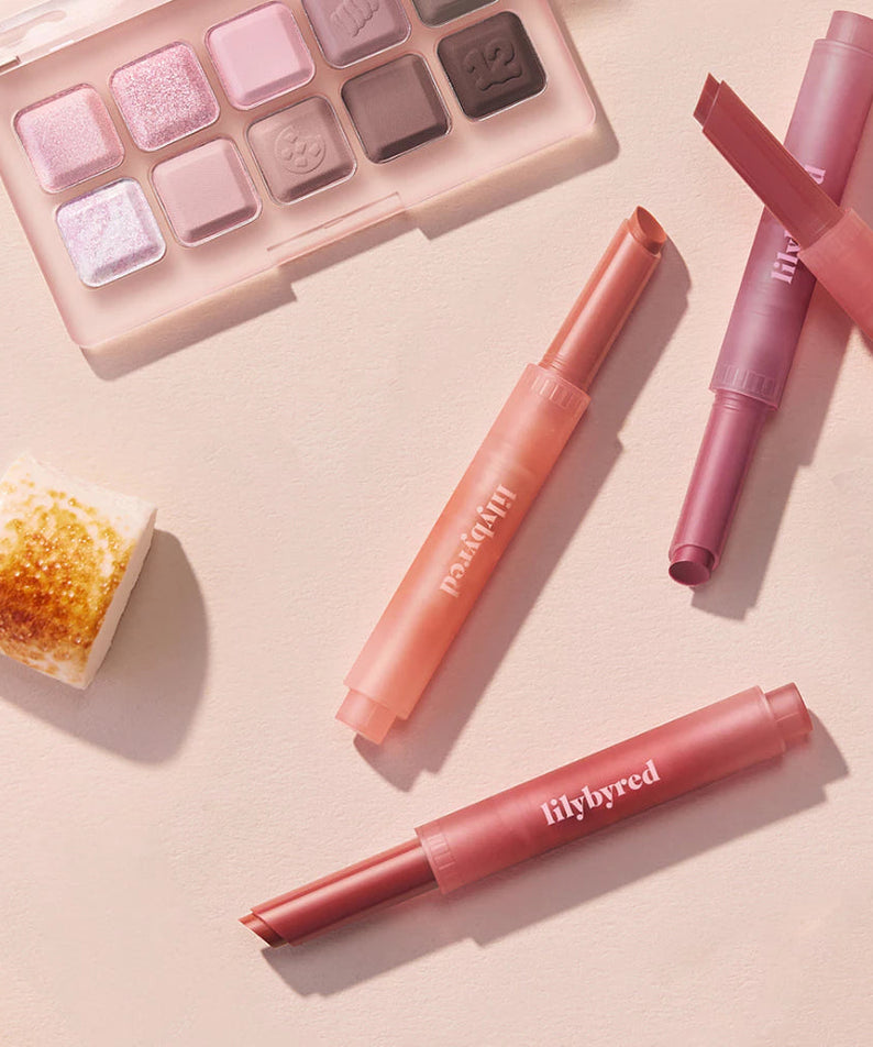 LILYBYRED Milky Blur Fondue Bar with makeup palette and beauty products in soft pink shades.