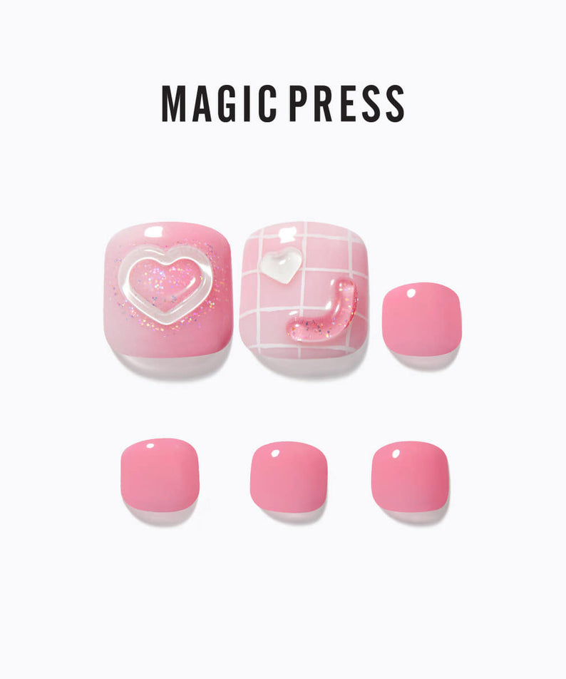 Set of DASHING DIVA MAGIC PRESS Love Joy pink press-on nails with heart accents and grid pattern.