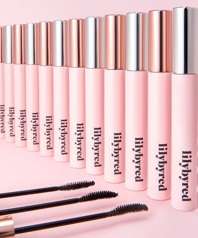 Image of LILYBYRED am9 to pm9 Infinite Mascara collection with pink and metallic packaging.