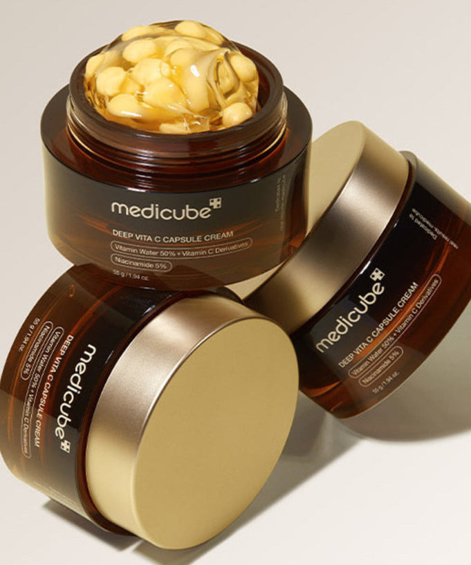 MEDICUBE Deep Vita C Capsule Cream 55g skincare product in brown and gold jar with visible capsule cream texture
