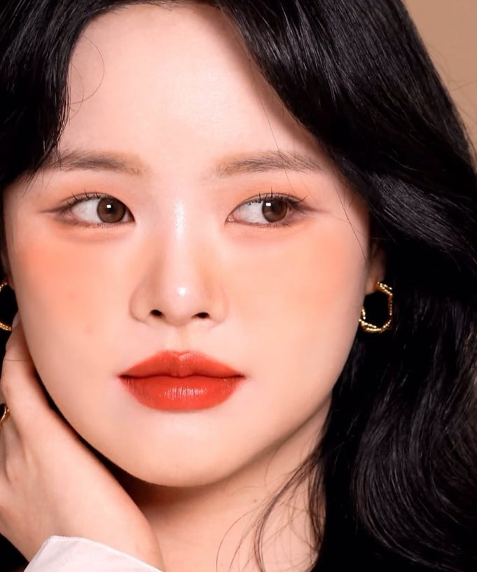 Model wearing MOOLDA Tattoo Fixing Lip Tint with vibrant red lips, showcasing flawless application and long-lasting color.