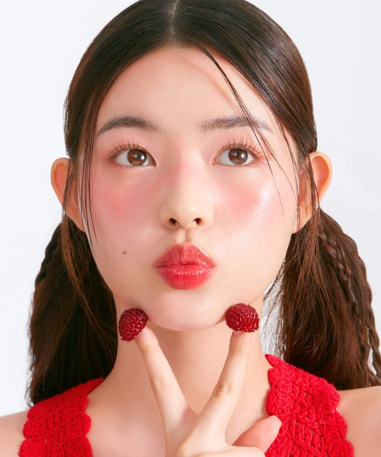 Woman wearing MOONSHOT Melting Mood Lip & Cheek with berry accents and red top