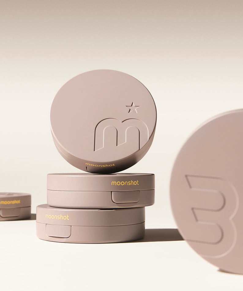MOONSHOT Conscious Fit Cushion Foundation in stack, showcasing product design and branding.