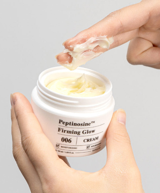BARULAB Peptinosine Firning Glow Cream 50ml being applied by hand from an open jar