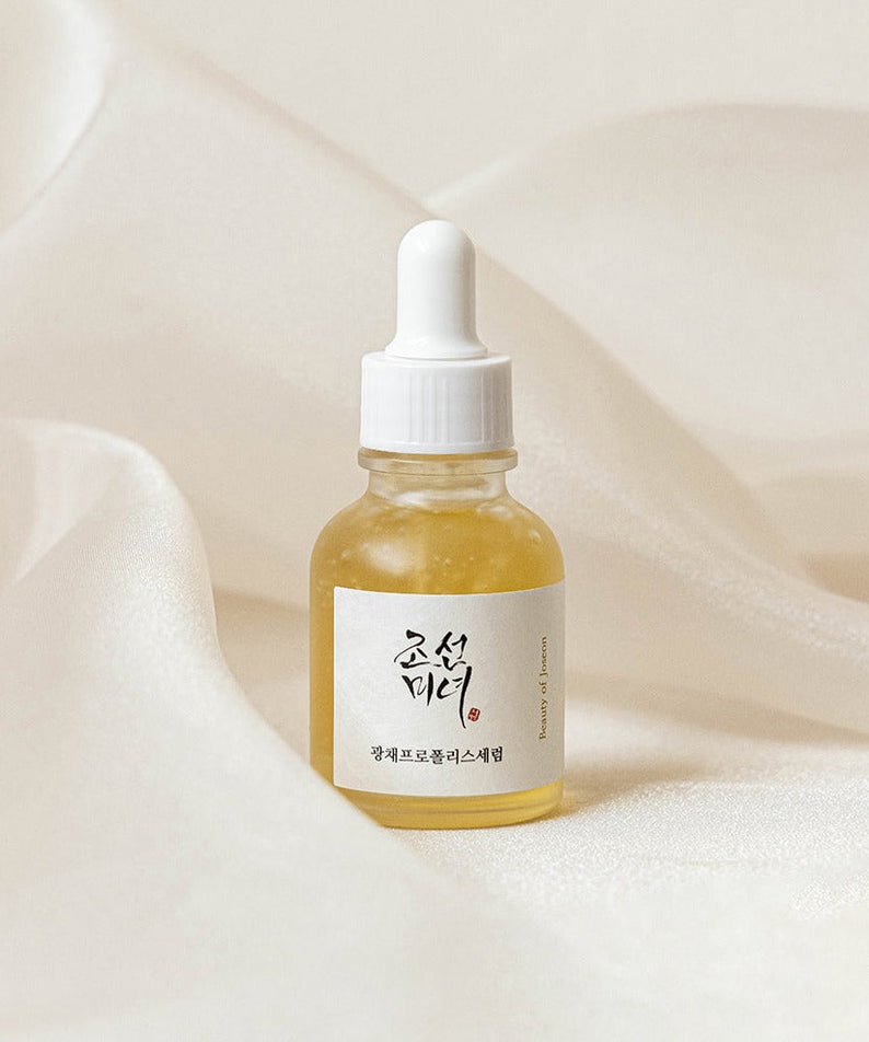 BEAUTY OF JOSEON Glow Propolis Serum 30ml bottle on elegant fabric background for skincare