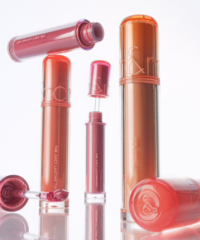 ROMAND The Juicy Lasting Tint displayed in various shades, showcasing vibrant lip colors.