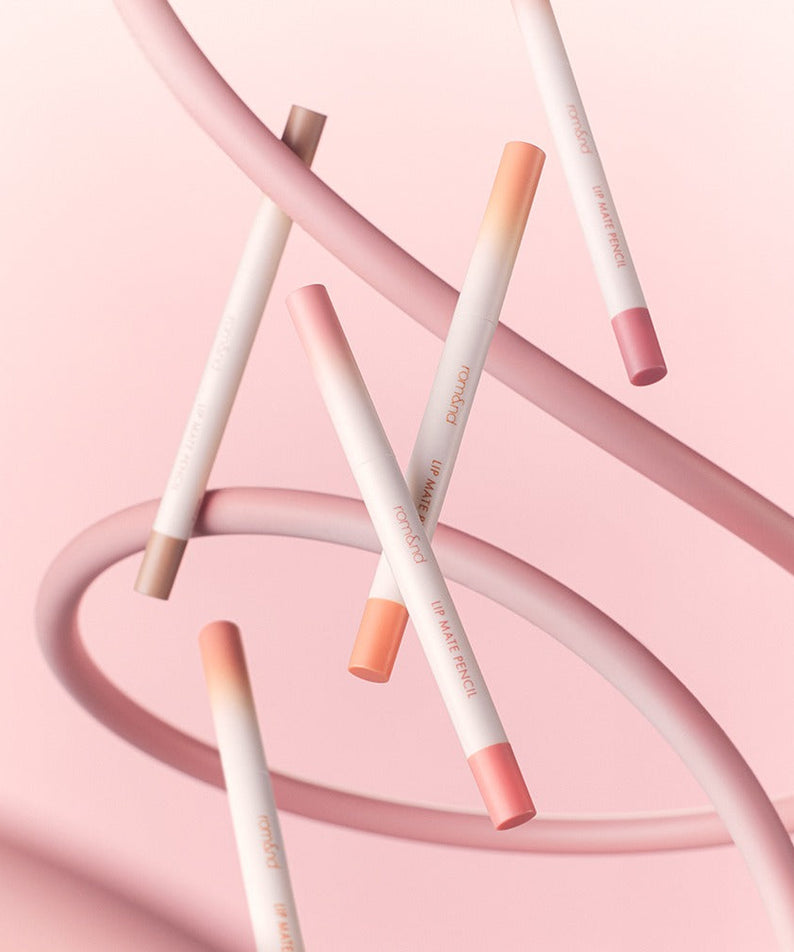 ROMAND lip mate pencil #beovershade displayed artistically with pink background