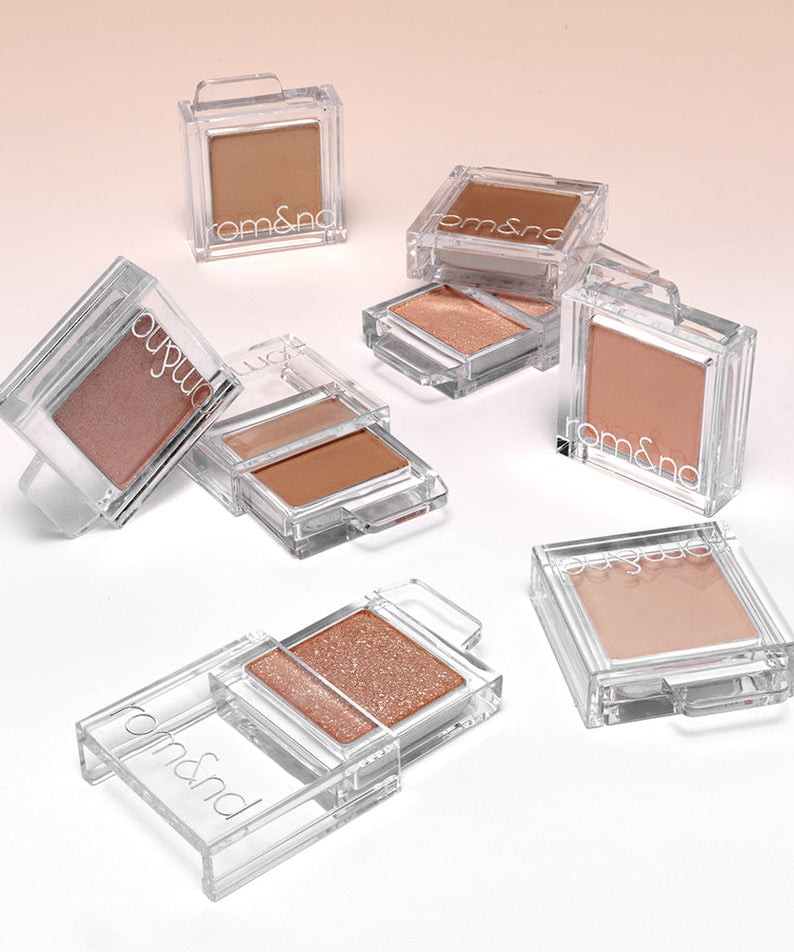ROMAND Slide In Single eyeshadow collection displayed in various shades on a light background.