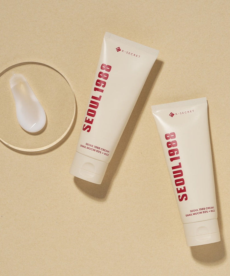 SEOUL 1988 Snail 93 Cream tubes on a beige background with a swatch of cream displayed.