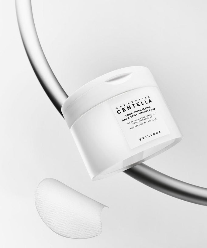 SKIN1004 Madagascar Centella Tone Brightening Dark Spot Ampoule Pads (60 sheets) with packaging and single pad on display