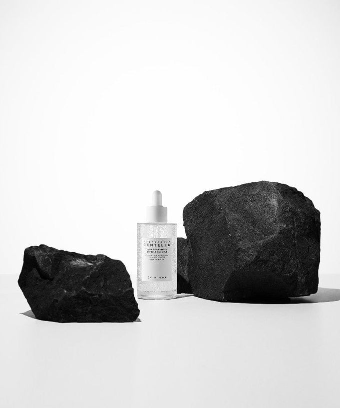 SKIN1004 Madagascar Centella Tone Brightening Capsule Ampoule 100ml with black rocks background