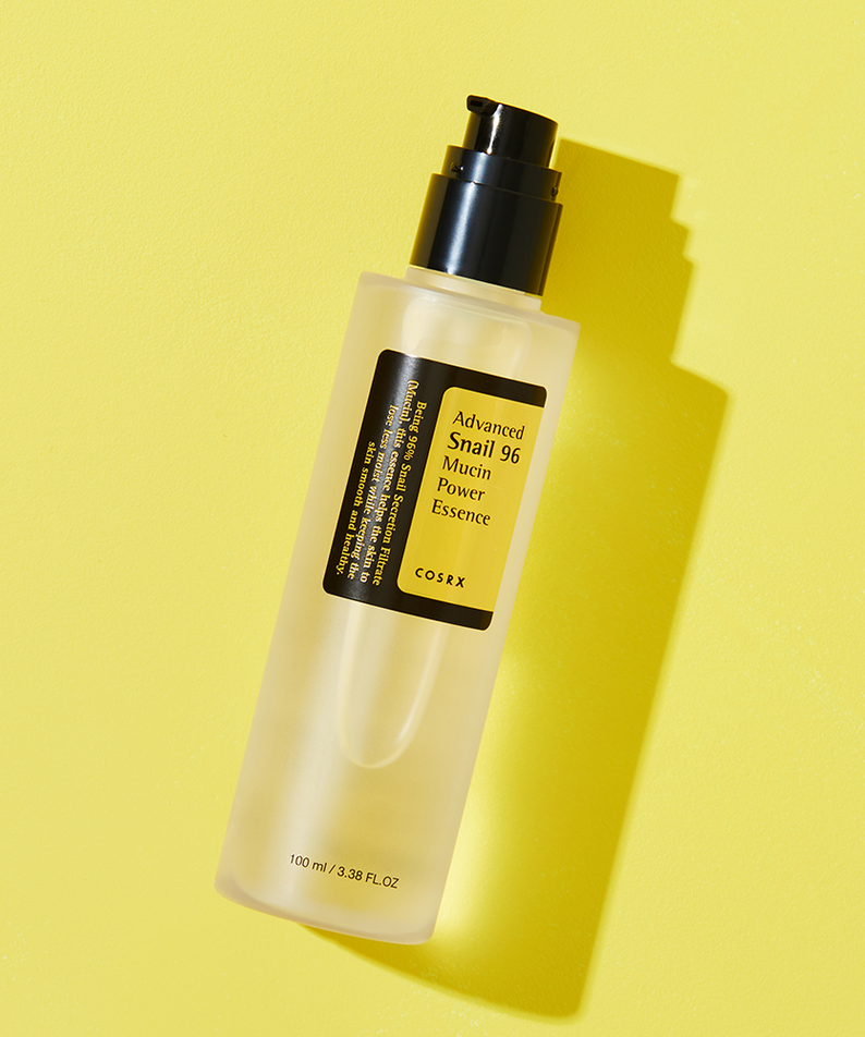 COSRX Advanced Snail 96 Mucin Power Essence 100ml bottle on yellow background
