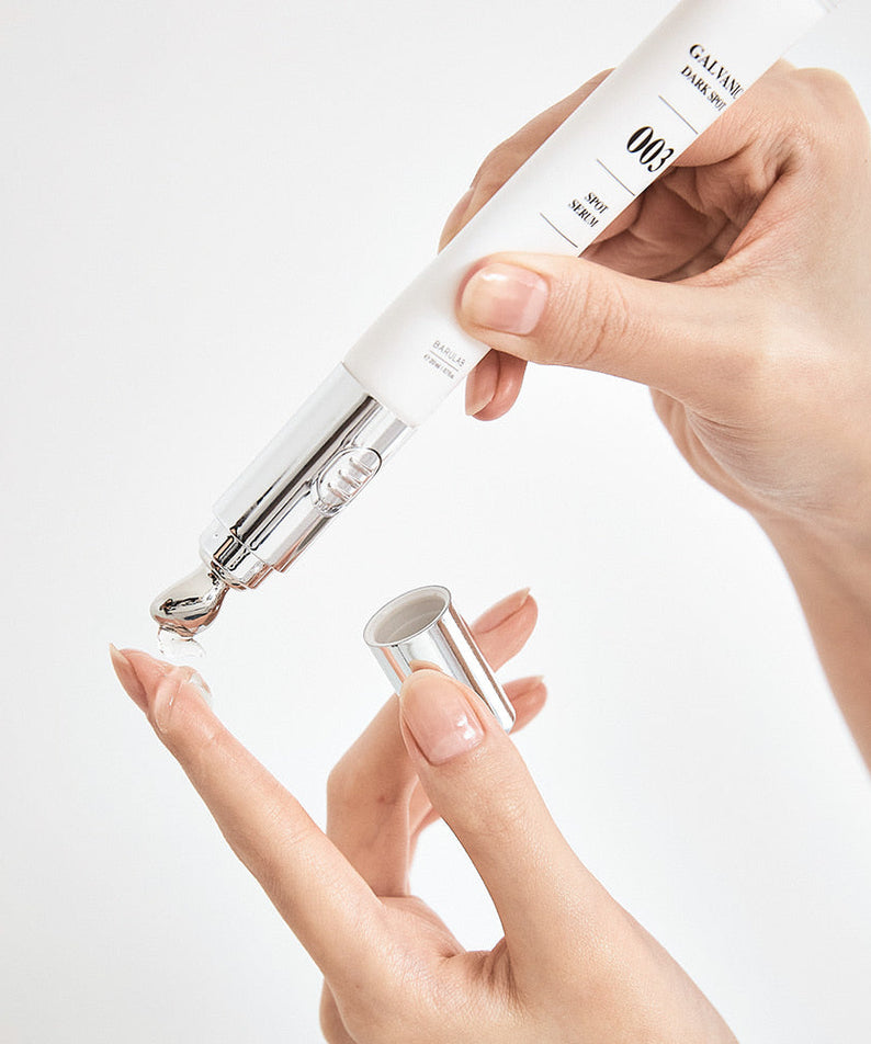 Applying BARULAB Galvanic Dark Spot Serum 20ml with precision applicator