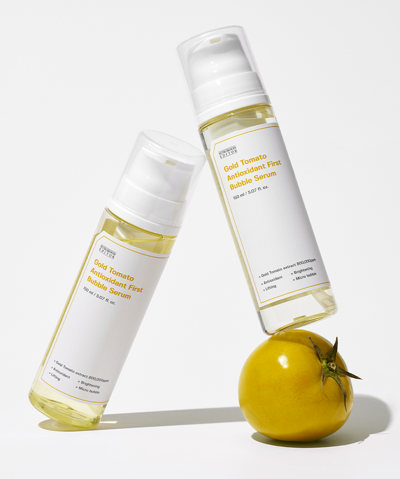 SUNGBOON EDITOR Gold Tomato Antioxidant First Bubble Serum 150ml bottle with a tomato, showcasing skincare product.