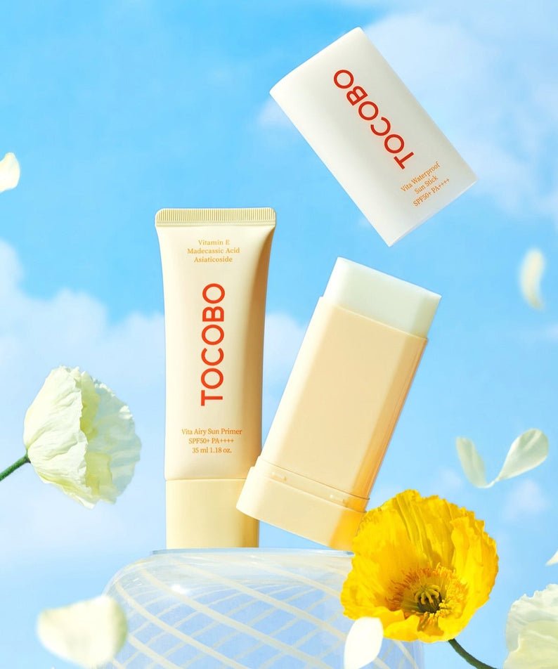 TOCOBO Vita Airy Sun Primer 35ml shown with bright flowers against a blue sky background.