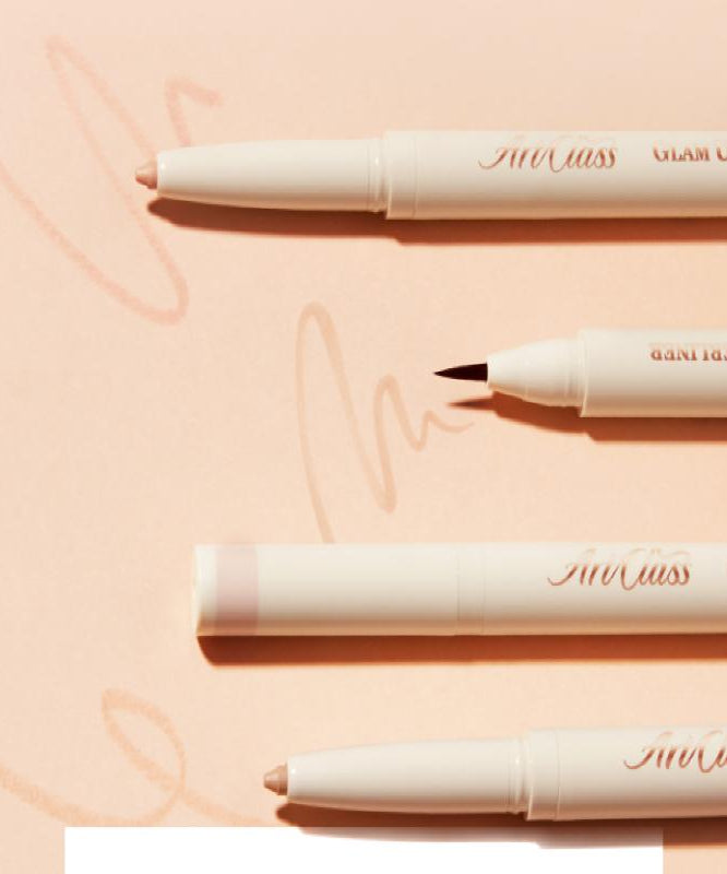 Close-up of TOO COOL FOR SCHOOL Glam Under Liner showcasing different pen tips on a peach background.