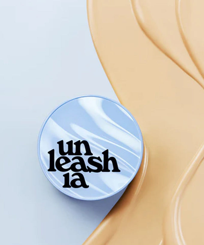 UNLEASHIA Babe Skin Baby Blue Cushion with smooth beige background