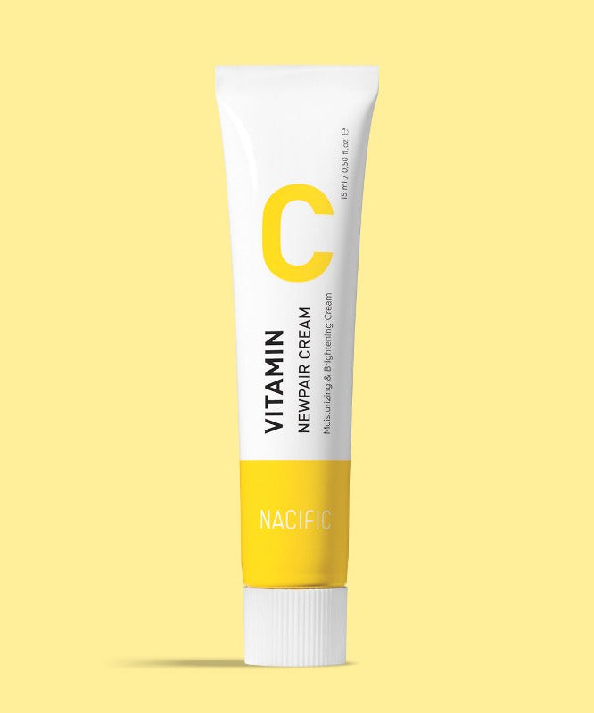 NACIFIC Vitamin C New Pair Cream 15ml in a yellow tube against a soft yellow background.